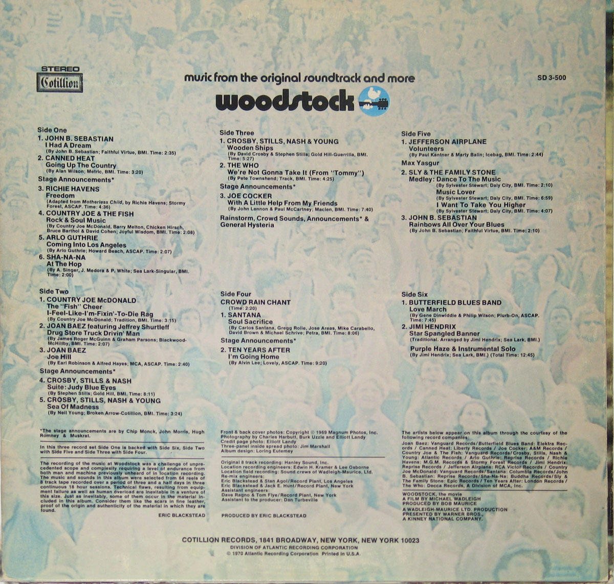 Back cover of Woodstock Music from the Original Soundtrack USA, displaying track listings, credits, and production details on a blue-toned background with faded images of festival attendees.